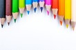 © Poh Smith - Top view of colourful crayons or colour pencil set in range isolated on white paper background.Education,Business office and Arts Concept.Copy space empty blank for text.Back to school
