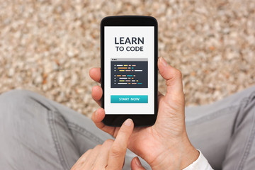 Wall Mural - learn to code concept on smartphone screen