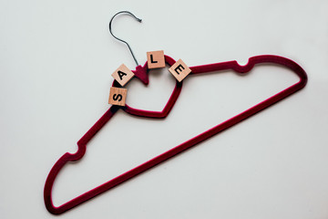 Pink clothing hangers isolated on the white background. Shopping concept. Black Friday Concept.