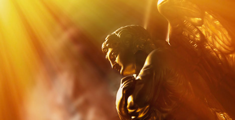 Fototapete - Gold angel in the sunlight. Antique statue.