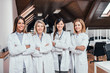 © bnenin - Beautiful female medical team standing with crossed arms.