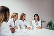 © bnenin - Group of medical staff meeting around the table.