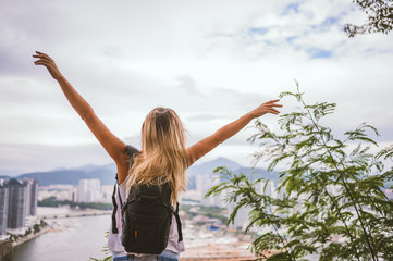 Traveler blonde backpacker woman walking overlooking the downtown. Travel adventure in China, Tourist beautiful destination Asia, Summer holiday vacation trip. Freedom and happy people concept