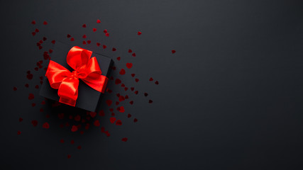 Wall Mural - merry christmas and happy holidays. new year. valentine's day. birthday. black gift with red ribbon,