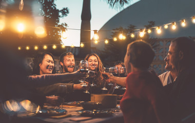 happy family dining and tasting red wine glasses in barbecue dinner party - people with different ag