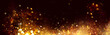 Golden Christmas and New Year glittering stars swirl on black bokeh background, backdrop with sparkling golden stars, holiday garland, magic glowing dust, lights. Gold Abstract Glitter Blinking sparks