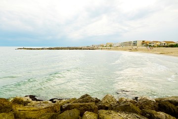 Rocks on the beach near holiday resort