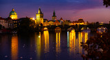 Fototapeta Paryż - Evening view of Charles Bridge with illumination. Prague. Czech Republic