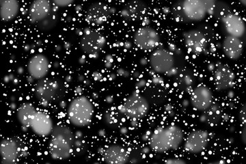 Texture of white snow blurry bokeh isolated black background. falling snow overlay. star sky. Black spots on white background, white drops and spots