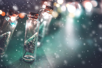 Wall Mural - close-up, elegant christmas tree in glass jar with snowflakes background. copy space.