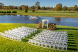 beautiful outdoor wedding venue at a country club with lake and fountain
