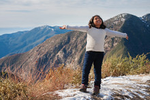 A Little Girl On The Edge Of A Snow Covered Mountain, Expressing Joy After Reaching The Hiking Trails Summit In San Bernardino Mountains.