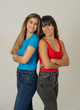© SB Arts Media - Portrait of happy girlfriends having fun isolated on neutral background