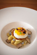 Fine dining poached egg with white asparagus, truffles and béarnaise sauce
