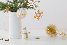 Modern Christmas Sill Life In Jug With Snowman On White Backgrou