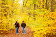 © Alejandro - Couple walking in a public park and enjoying the beauty of nature during autumn season.