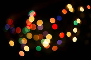 blur light bokeh color red green yellow on background black.