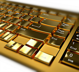 Close-up on a golden keyboard on white background, with depth of field