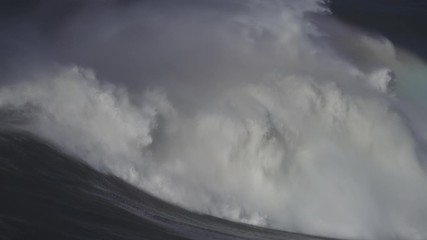 Wall Mural - Large foamy wave rolling on the surface of a stormy ocean, 4k