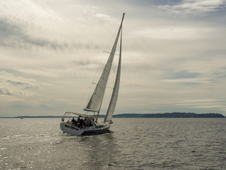 Wall Mural - Sailboat sailing off into distance