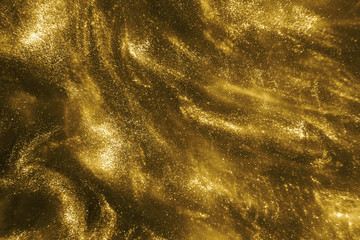 Wall Mural - Abstract elegant, detailed gold glitter particles flow with shallow depth of field underwater. Holiday magic shimmering luxury background. Festive sparkles and lights. de-focused.