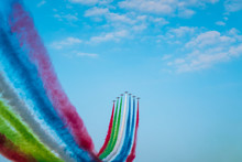 Jet Planes Leaving Colorful Trails On The Sky During An Airshow
