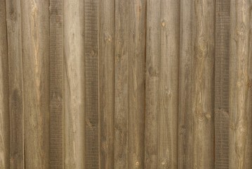 gray brown wooden background of a  boards in the wall of the fence