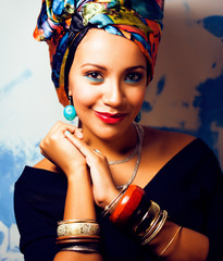 Wall Mural - beauty bright african woman with creative make up, shawl on head like cubian closeup smiling