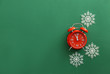 © Pixel-Shot - Alarm clock with snowflakes on color background