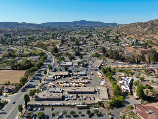 Wall Mural - Aerial view of small city Poway in suburb of San Diego County, California, United States. Small road and houses next the valley during dry summer season