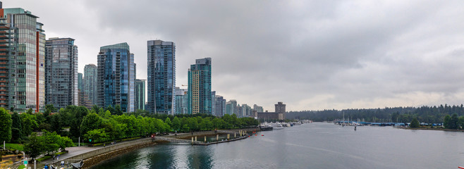 Wall Mural - Coal Harbor in Vancouver British Columbia with downtown buildings boats and reflections in the water