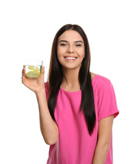 Sticker - Beautiful young woman with tasty lemon water on white background