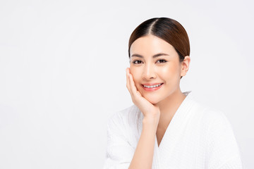 Beauty shot of bright skin Asian woman with hand touching face