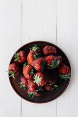 Wall Mural - Bright photo of strawberries on a white background