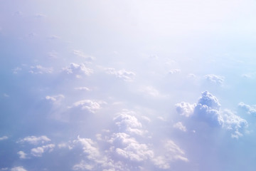 Soft focus of cloudscape or white cloud and blue sky from window of air plane.