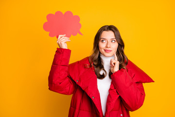 Wall Mural - Photo of charming pretty lady holding empty paper cloud have creative idea to fill it finger on cheek clever person wear red winter overcoat isolated yellow color background