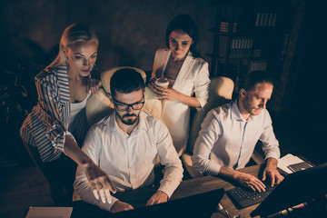 Wall Mural - Photo of four business people partners working late night drink coffee workaholics watching assistant project work notice indicate finger mistake formalwear dark office indoors