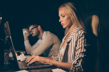 Poster - Profile photo of two business partners guy lady sitting chairs table working together late night overwhelmed difficult tasks troubled formalwear lamp light indoors