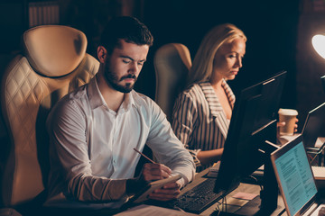 Sticker - Portrait of her she his he two nice attractive focused concentrated coworkers meeting creating task solution preparing report researching data at night preparing report at work place station dark room