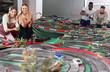 © JackF - Gambling adult people play in childrens racing track
