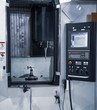 © Itsanan - Modern industrial production CNC vertical machining center. Industrial metalworking machinery