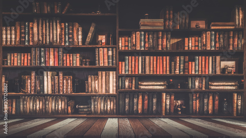 Fotomural blurred bookshelf Many old books in a book shop or library