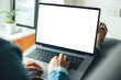 © panitan - mockup image blank screen computer with blank white background for advertising text,hand man using laptop contact business search information on desk at home office.marketing and creative design
