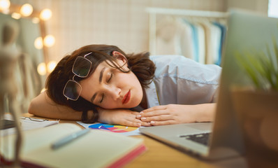 Woman is sleeping at workshop