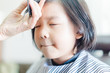© MIA Studio - Asian little girl haircut. hairdresser, beauty salon.Cute little asian girl in hairdressing salon.