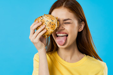 young woman eating a sandwich