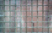 Old Glass Wall Made Of Transparent Blue, Green Tiles. Rough Surface Texture
