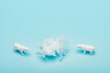 Toy Polar Bears With Polyethylene Bag On Blue Background, Environmental Pollution Concept