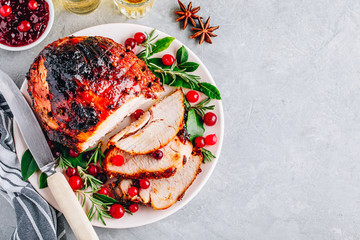 Glazed Ham with cranberry sauce. Roasted Holiday Pork with spices. Top view.