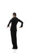 © LIGHTFIELD STUDIOS - back view of elegant dancer performing tango on white background